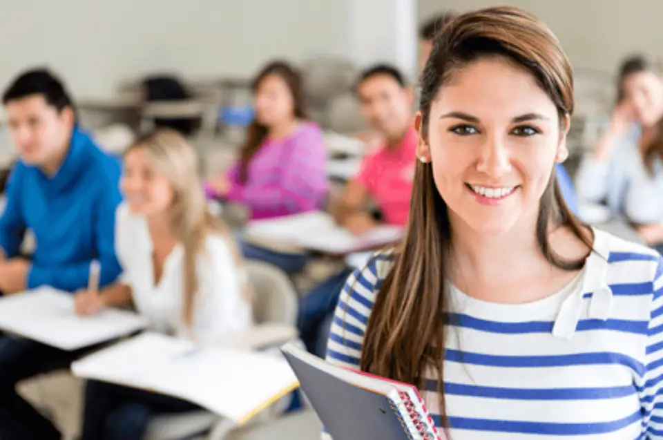 Smiling student in a classroom