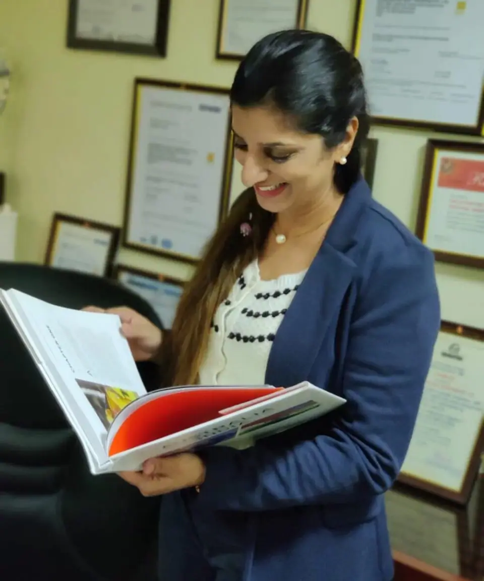 UEMS founder Shalini Menon reviewing a student file in the office
