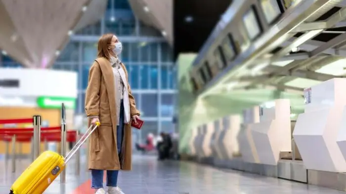 Traveller with luggage at an airport