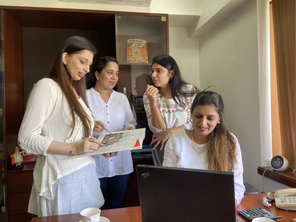 UEMS team counselling students in the office